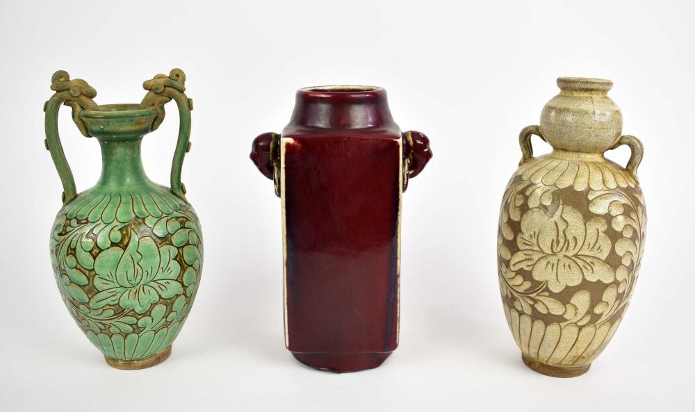 Appraisal: THREE CHINESE EARTHENWARE VESSELSComprising a flamb sang de boeuf glazed