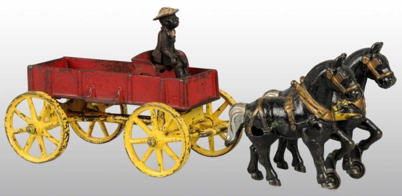 Appraisal: Cast Iron Kenton Farm Wagon Toy Description Pulled by two