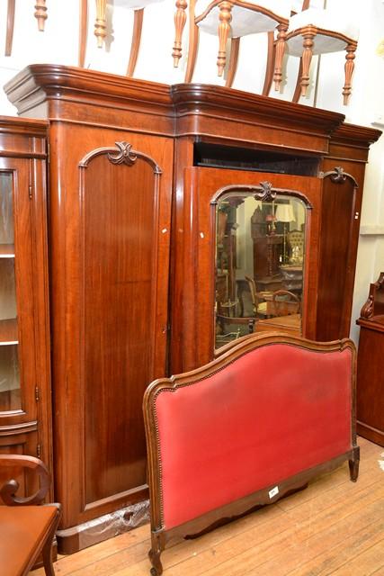 Appraisal: A VICTORIAN CEDAR THREE DOOR WARDROBE A VICTORIAN CEDAR THREE