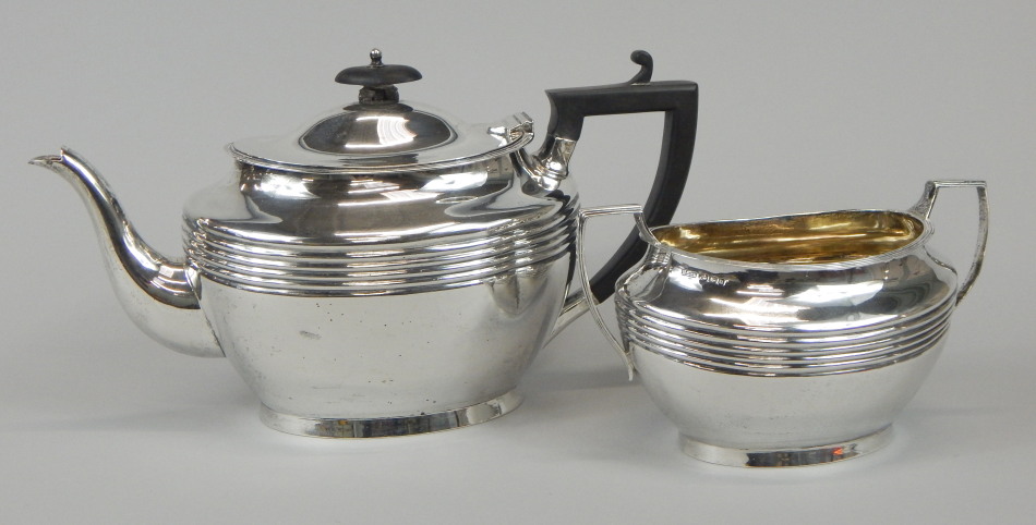 Appraisal: A George V oval silver teapot with ebonised knop and