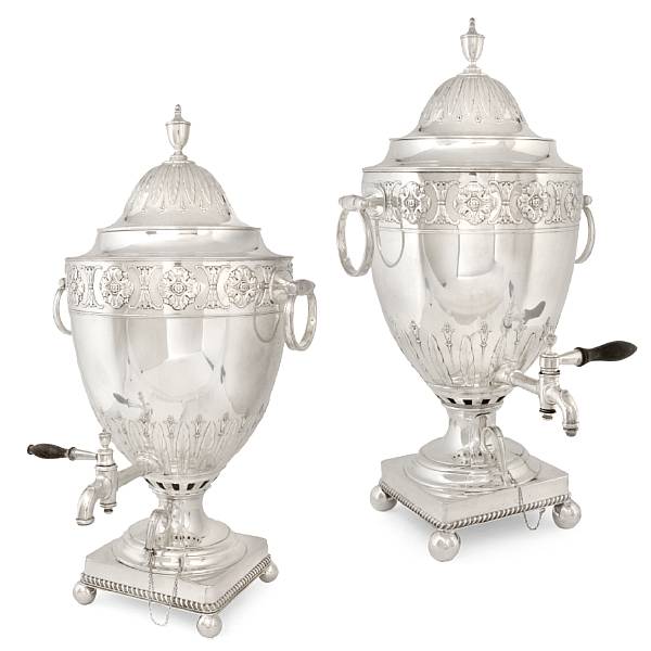 Appraisal: A pair of George III style plated coffee urns unmarked