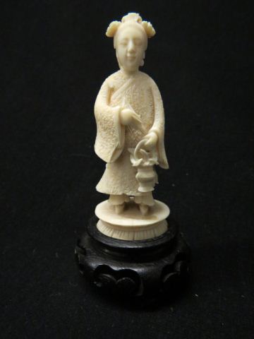 Appraisal: Chinese Carved Ivory Figurine of a Lady with basket excellent