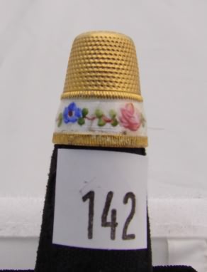 Appraisal: Gold tone thimble with floral decorated enamel band