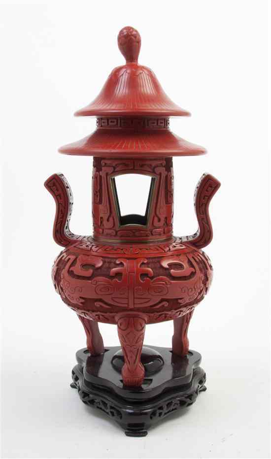 Appraisal: A Chinese Cinnabar Red Resin Censer surmounted with a tiered