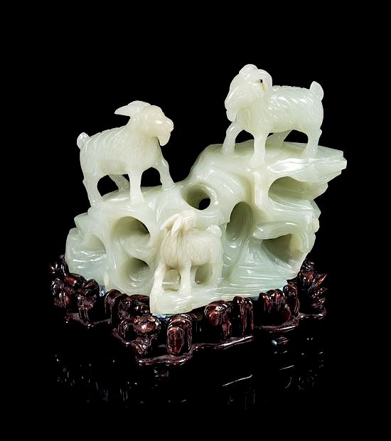 Appraisal: A White Jade Carving of Three Rams Height inches A