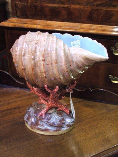 Appraisal: A COPELAND MAJOLICA MODEL OF A CONCH SHELL raised on