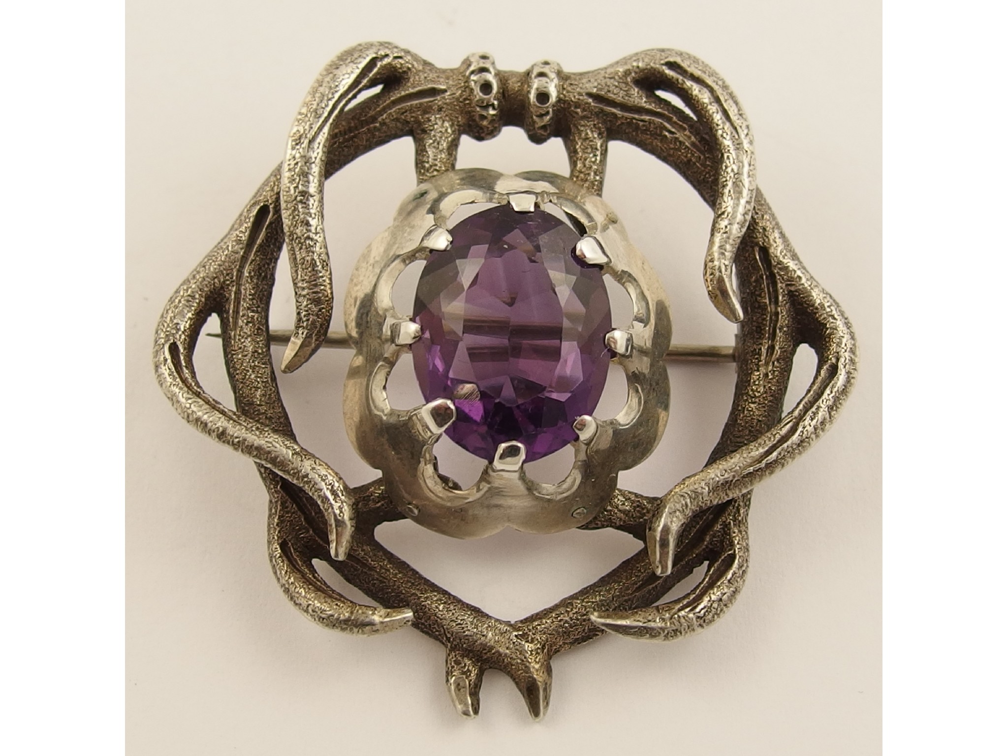 Appraisal: An amethyst brooch by Mackay of Elginthe central facet cut