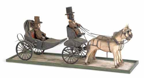 Appraisal: American carving of Abraham Lincoln in a horse drawn carriage