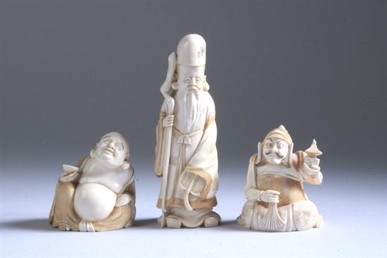 Appraisal: THREE JAPANESE IVORY OKIMONO Carved to depict hotei samurai and