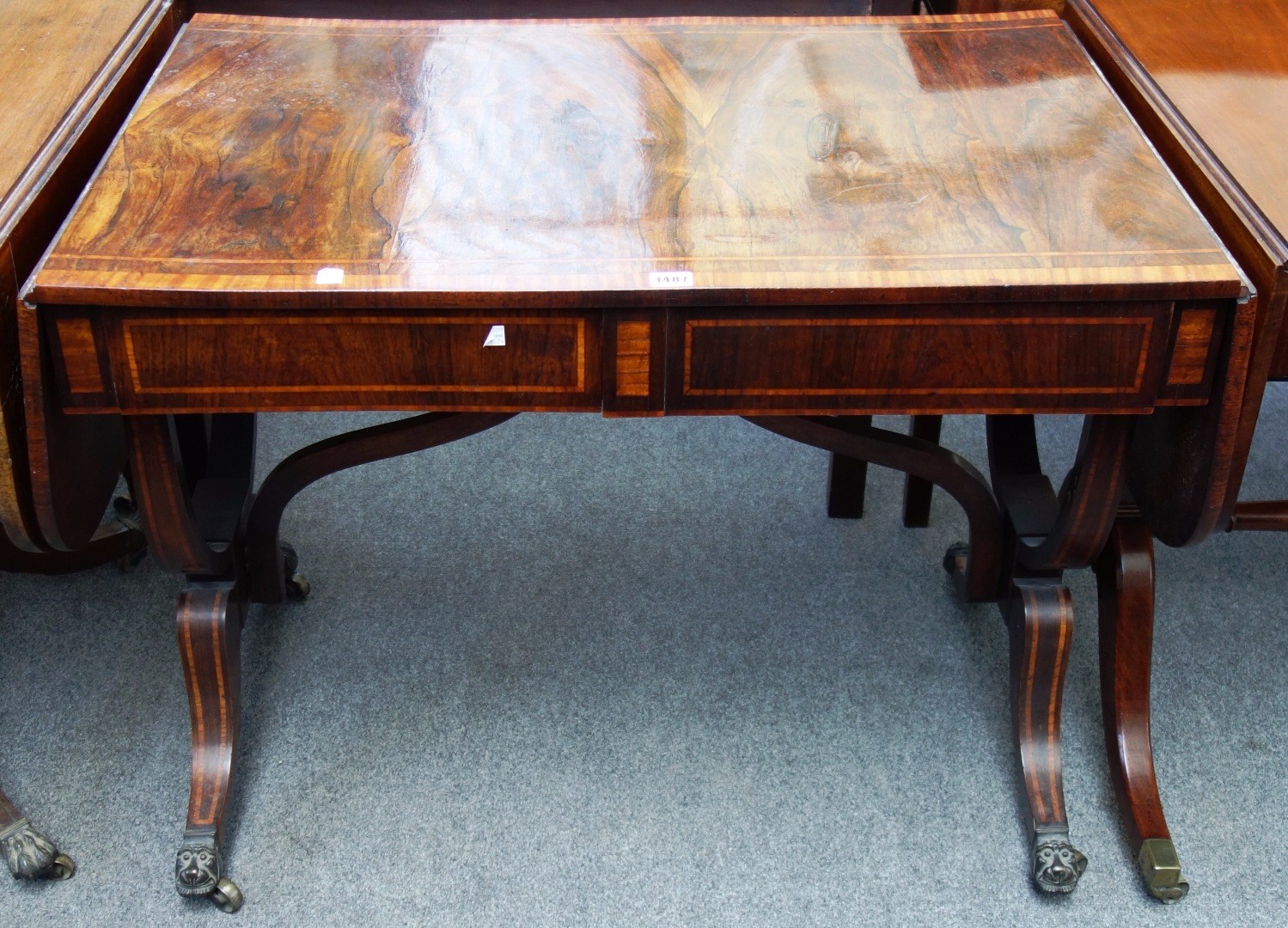 Appraisal: A Regency satinwood banded rosewood sofa table with pair of