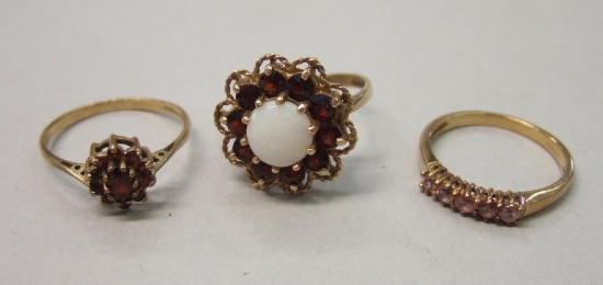 Appraisal: A ct gold opal and garnet set cluster ring a