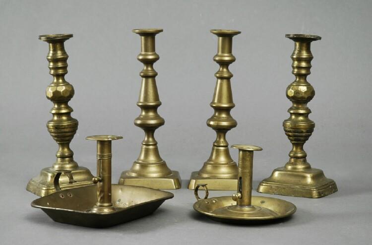 Appraisal: TWO PAIRS OF BRASS CANDLESTICKS AND TWO BRASS CHAMBERSTICKS Each