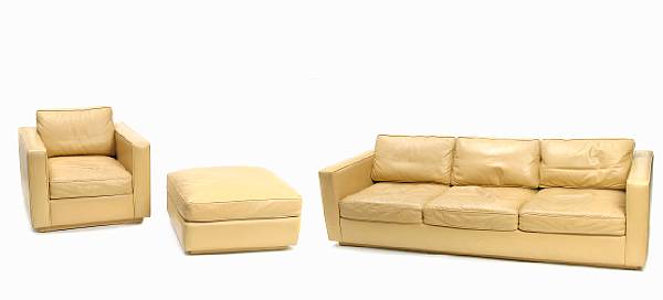 Appraisal: A leather upholstered sofa together with a chair and ottoman