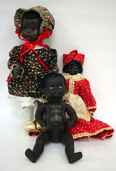 Appraisal: A MID TH CENTURY COMPOSITE BLACK DOLL with gilt hoop