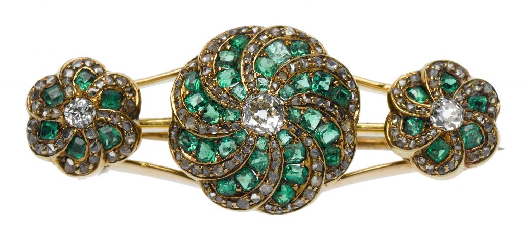 Appraisal: AN ANTIQUE EMERALD AND DIAMOND TRIPLE-CLUSTER BROOCH mounted in gold