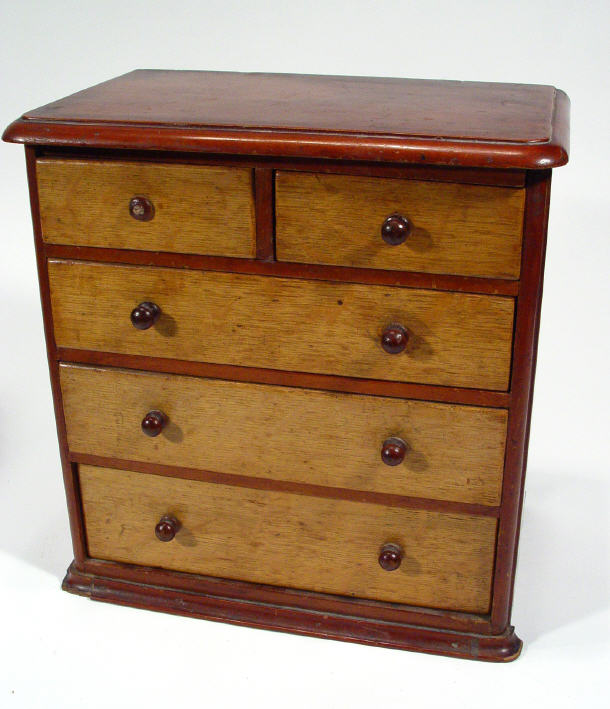 Appraisal: Victorian miniature mahogany and light oak chest fitted two short