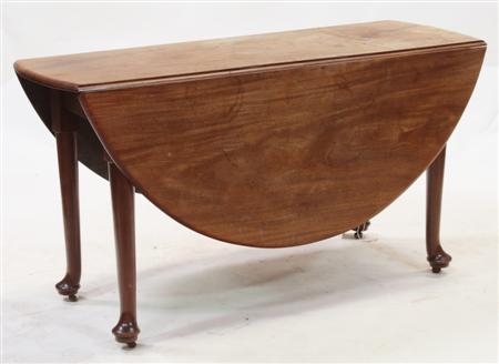 Appraisal: A Georgian mahogany drop-leaf table the oval top raised on