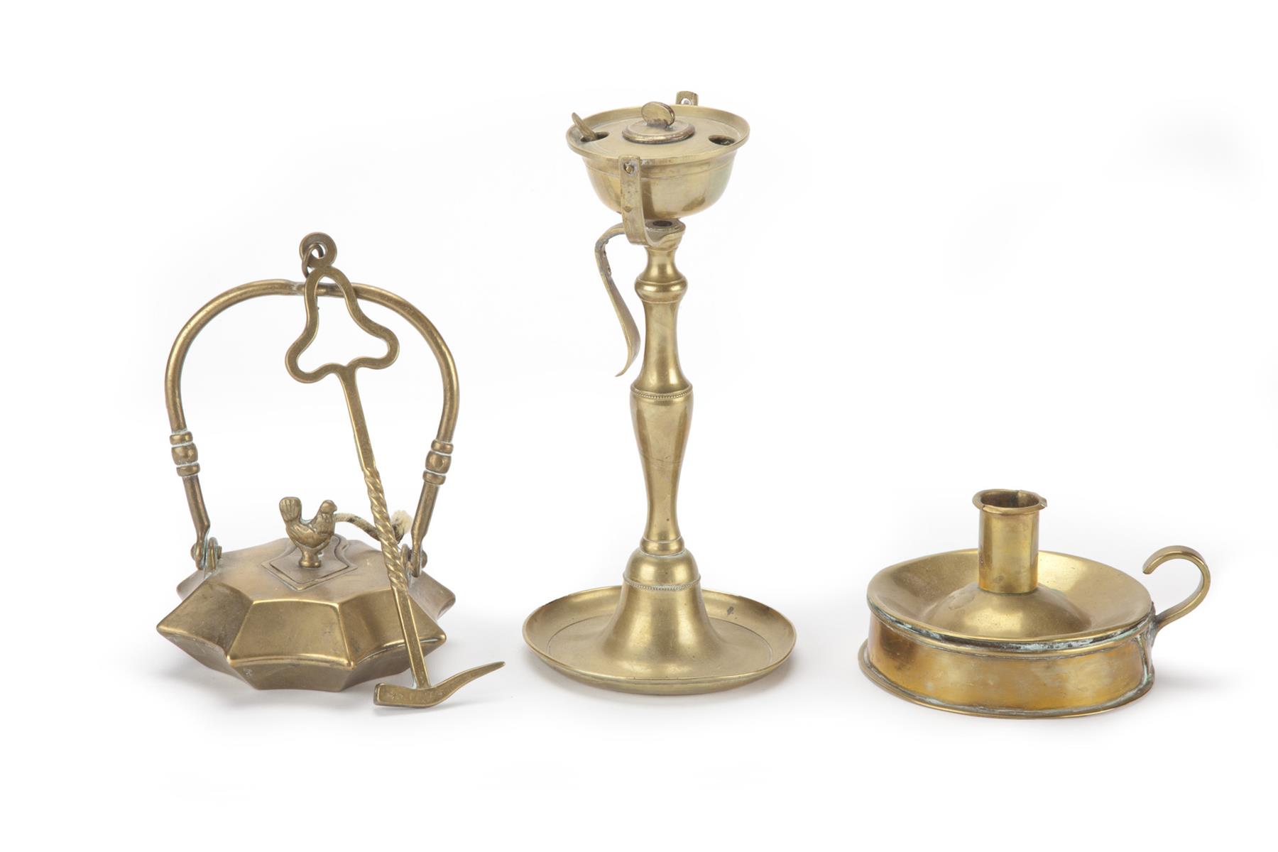 Appraisal: THREE EUROPEAN BRASS LIGHTING DEVICES Nineteenth century Tinderbox with candle