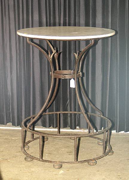 Appraisal: A French wrought iron marble top table th century height