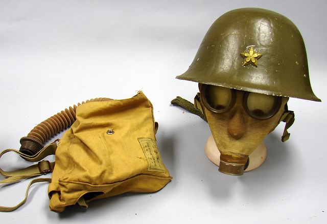 Appraisal: Lot consists of Japanese steel helmet with petal flower superimposed