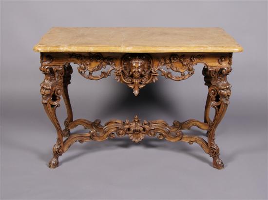 Appraisal: A Regency Style Carved Wood Center Table with Marble Top