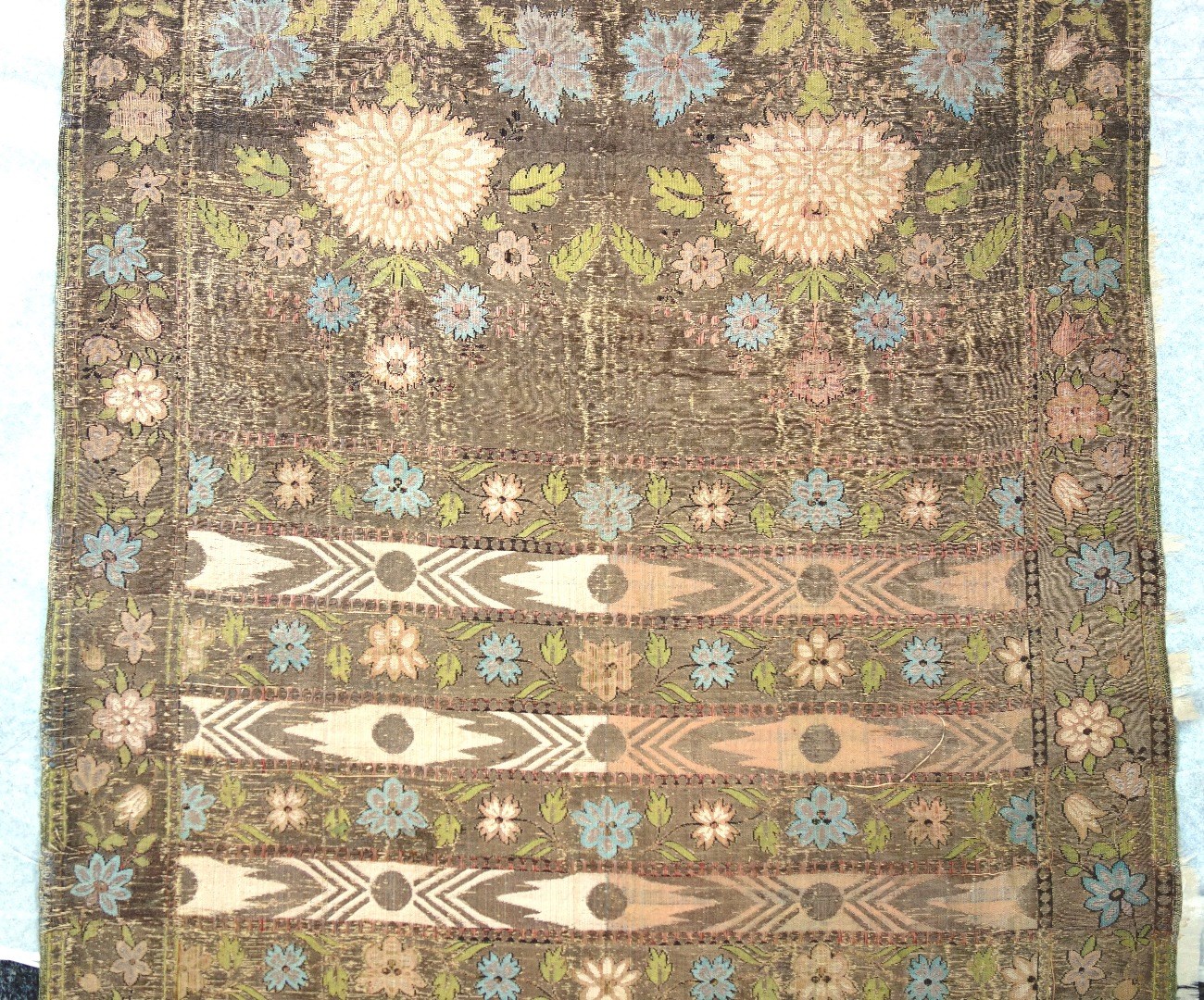 Appraisal: A foliate embroidered silk runner th century with gilt tasselled