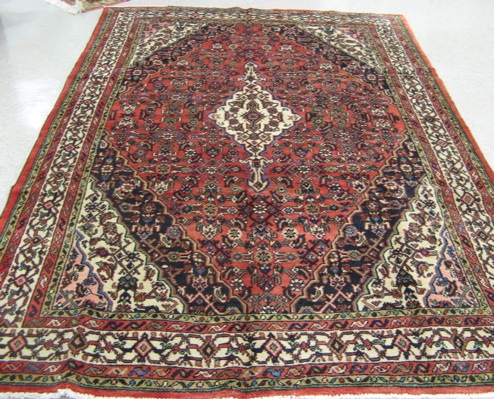 Appraisal: PERSIAN TRIBAL CARPET Hamadan villages region central medallion and Herati