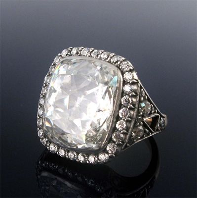 Appraisal: A substantial diamond cluster ring the cushion shaped diamond is