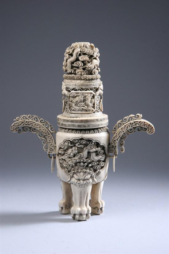 Appraisal: CHINESE CARVED IVORY TRIPOD CENSER Dragon decoration - in high