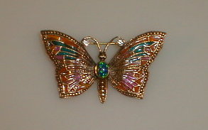 Appraisal: A yellow metal and faux opal set butterfly brooch