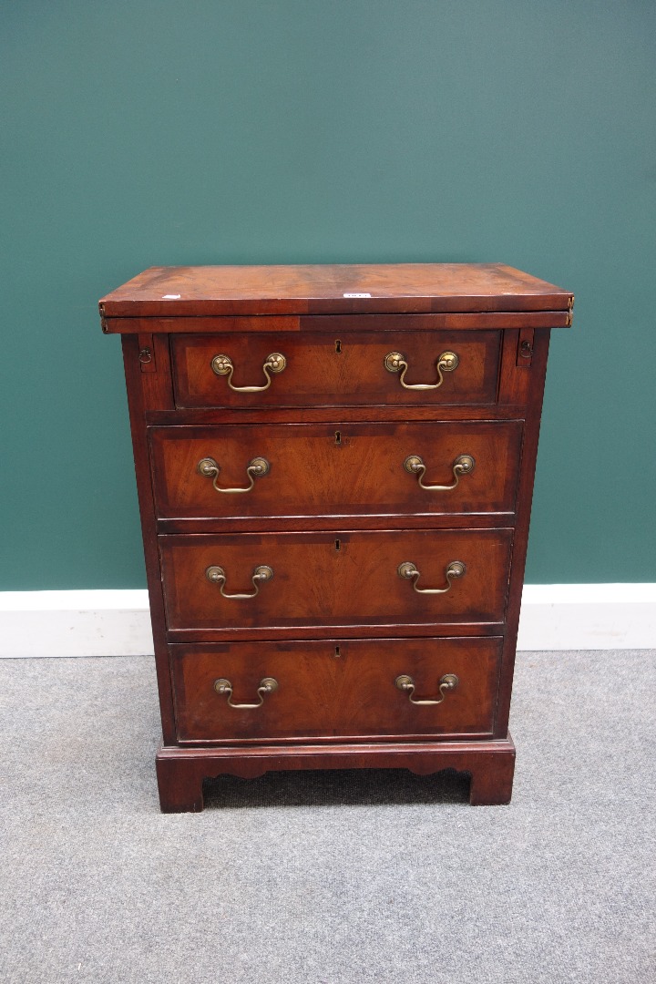 Appraisal: An th century style cross banded mahogany bachelors chest the