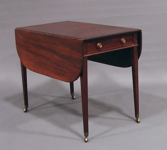 Appraisal: Molded drop-leaf top with rounded corners cock-beaded end drawer with