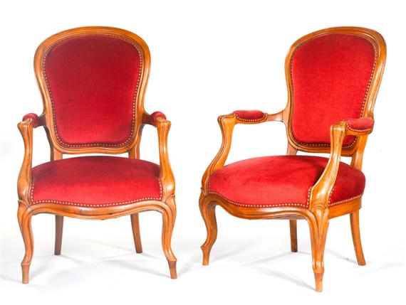 Appraisal: PAIR OF VOLTAIRE-FAUTEUILS Louis-Philippe Molded walnut Horseshoe-shaped seat on cabriole