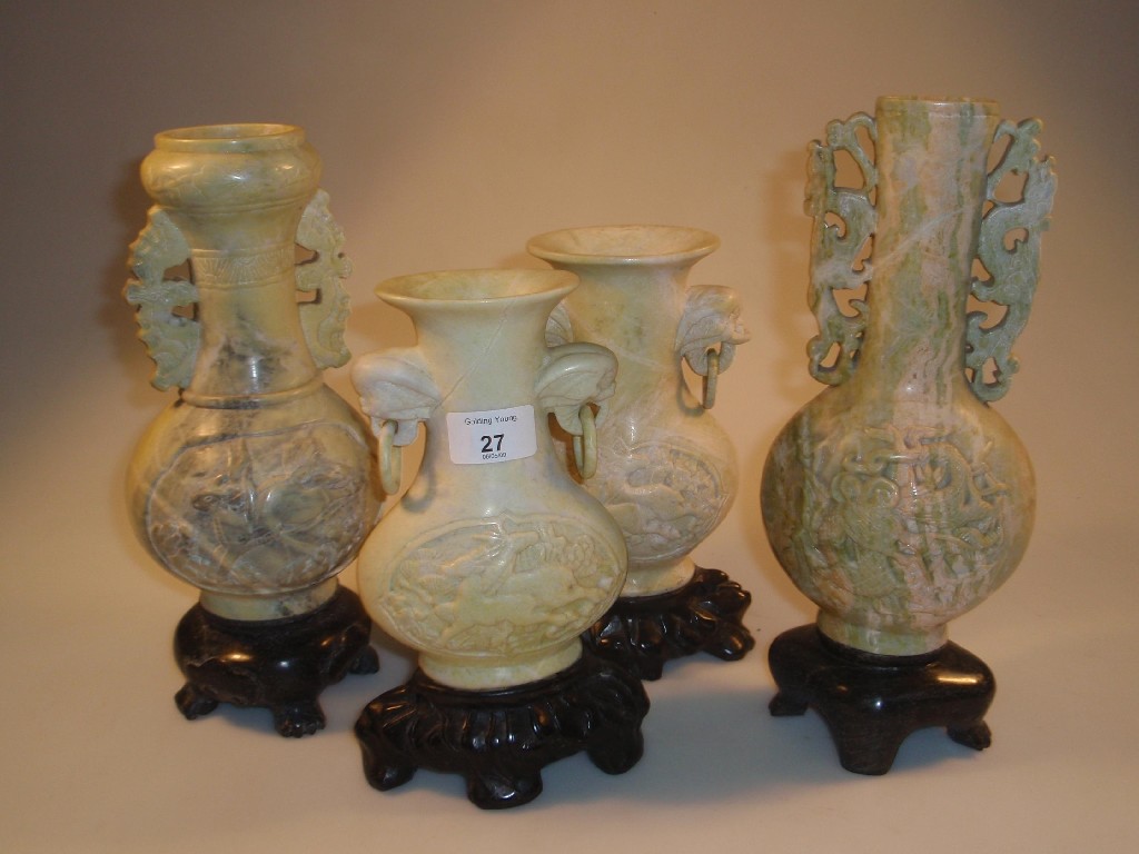 Appraisal: A pair of th century Chinese soapstone vases with integral