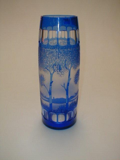 Appraisal: A Bohemian blue overlay glass vase of cylindrical form tapering