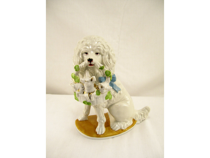 Appraisal: Porcelain Figural Dog w Piglets in Basket White porcelain figure