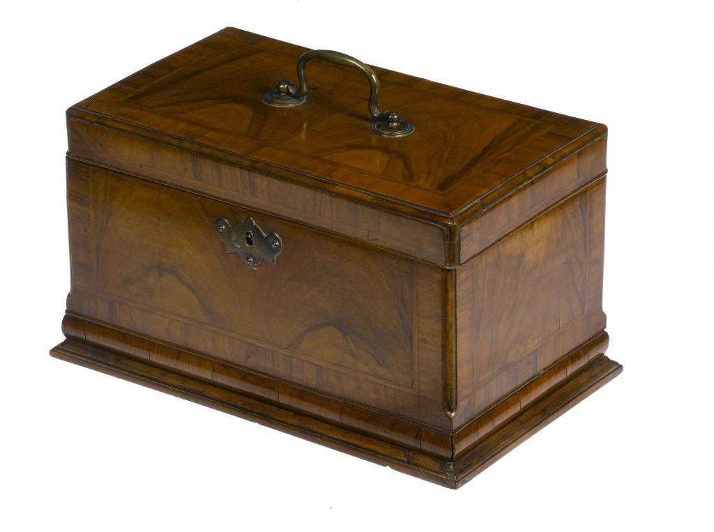 Appraisal: A GEORGE II WALNUT AND FEATHERBANDED TEA CADDY with moulded