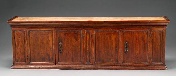 Appraisal: A Tuscan Baroque style walnut hanging cabinet th century The