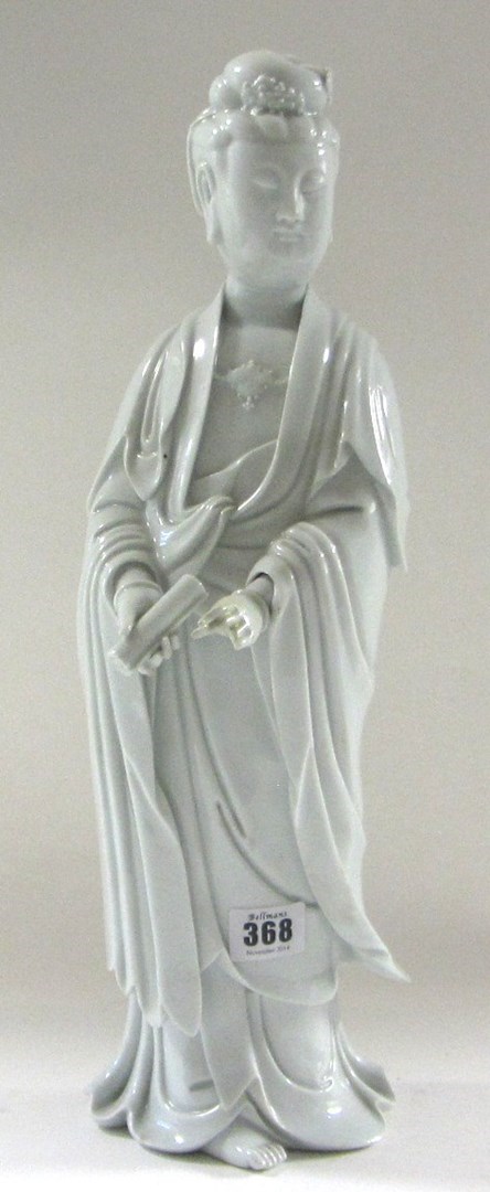 Appraisal: A Dehua figure of Guanyin th century modelled standing in