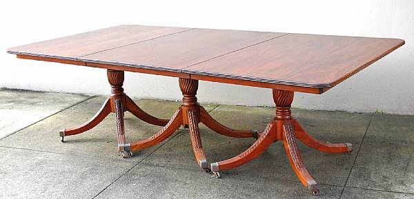 Appraisal: A George III style mahogany triple pedestal dining table