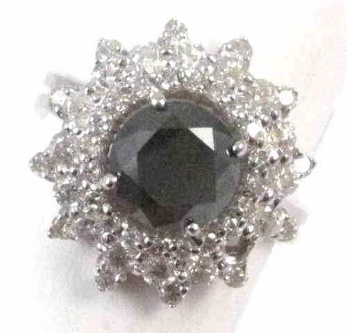 Appraisal: BLACK DIAMOND AND FOURTEEN KARAT GOLD RING round full-cut colorless