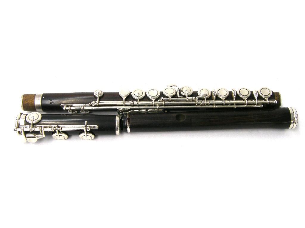 Appraisal: English cocuswood and silver mounted flute by and stamped Rudall