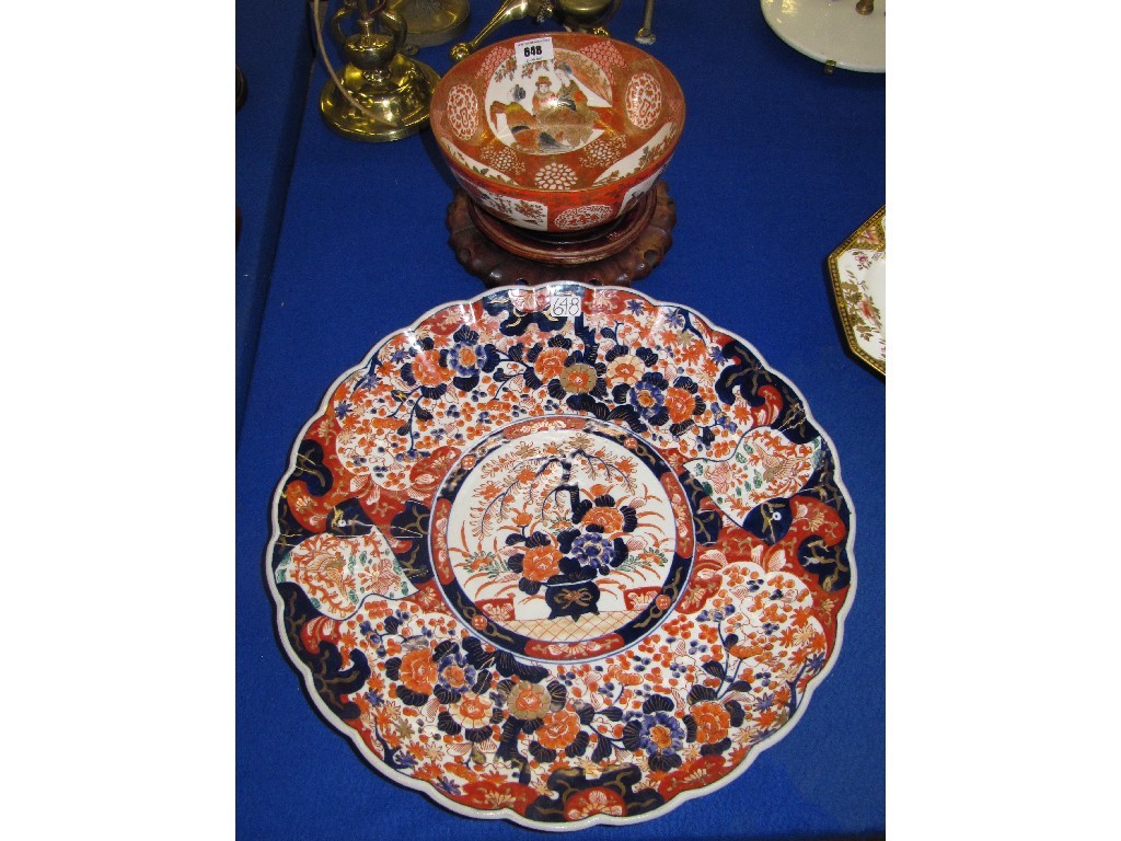 Appraisal: Kutani bowl decorated with figures and an Imari charger