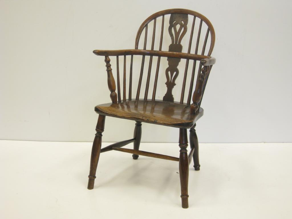 Appraisal: A th Century yew wood Windsor Elbow Chair with pierced