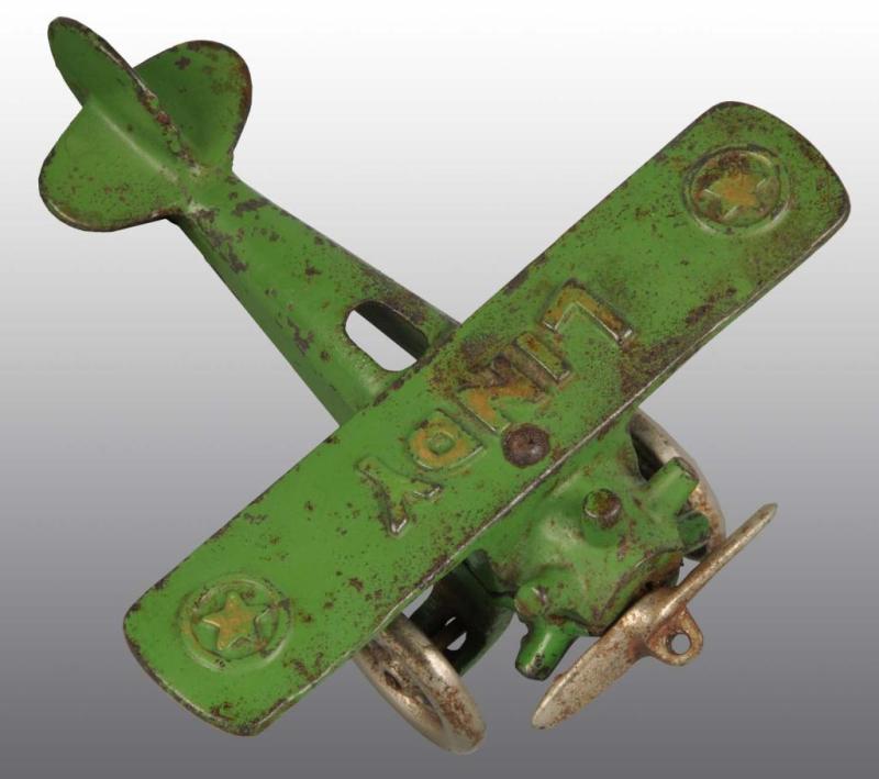 Appraisal: Cast Iron Green Hubley Lindy Star Airplane Toy Description All