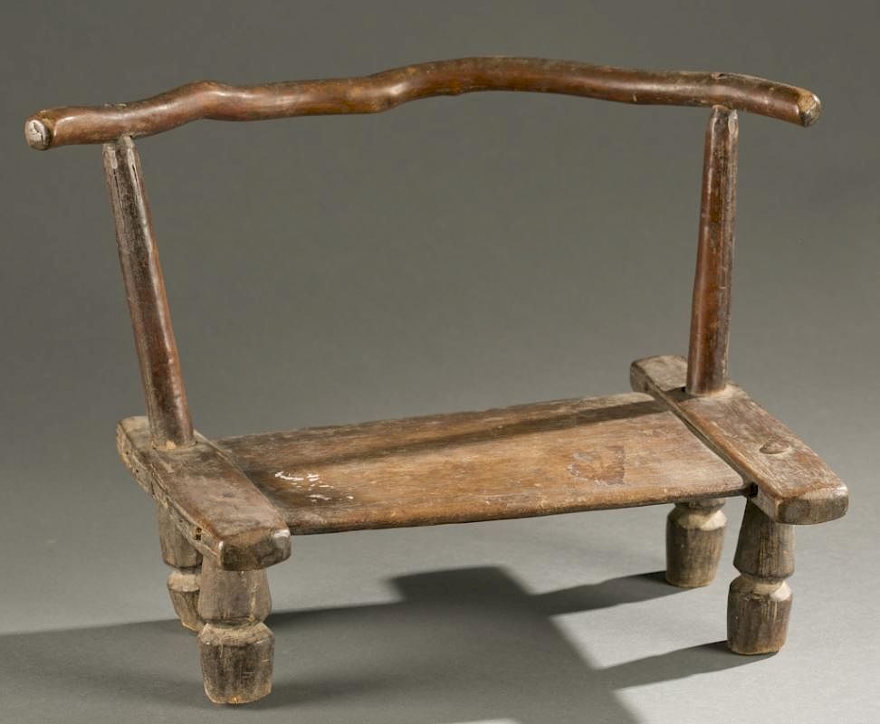 Appraisal: Liberian wooden chair th century A wooden chair with curved