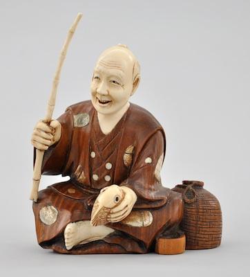 Appraisal: A Japanese Signed Okimono Ivory and Boxwood Fisherman Depicting hand