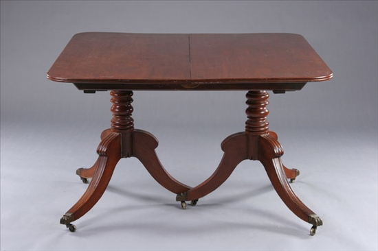 Appraisal: REGENCY MAHOGANY TWO-PEDESTAL DINING TABLE th century including three leaves