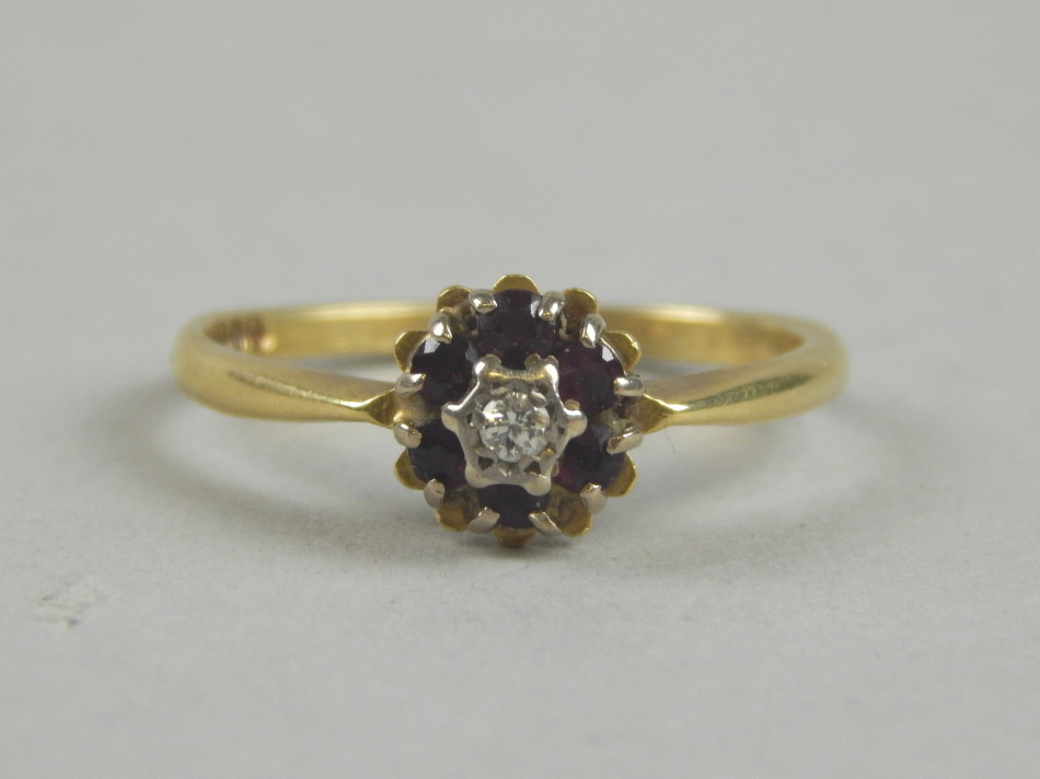 Appraisal: An ct gold ruby and diamond floral cluster ring with