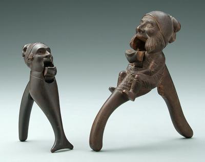 Appraisal: Two carved wood nutcrackers in seated man and - in